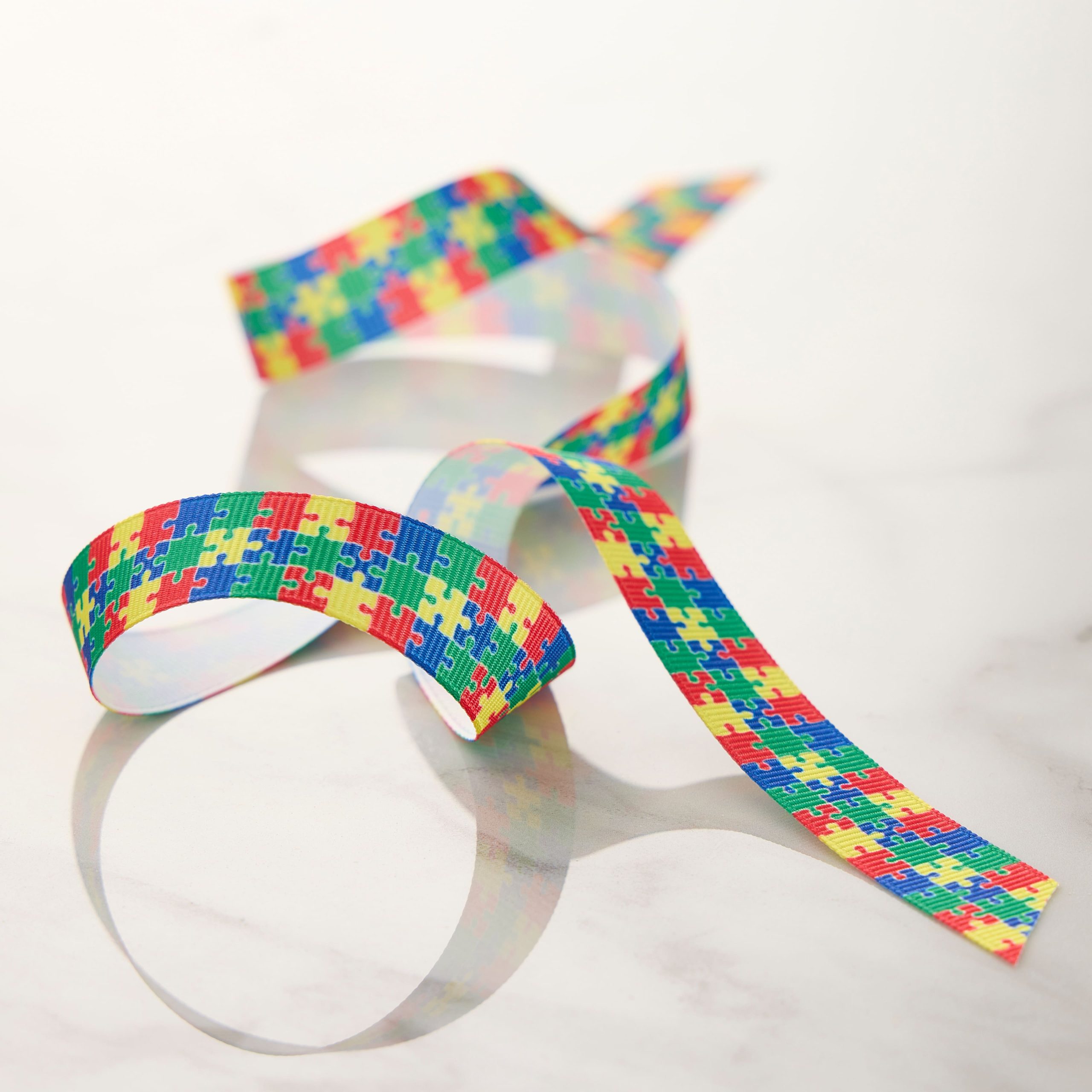 5/8" x 7yd. Multicolor Puzzle Pieces Grosgrain Ribbon by Celebrate It® Classic - Image 2